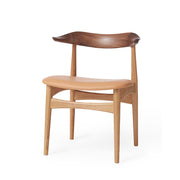 Warm Nordic Stol Cow horn chair sits nature